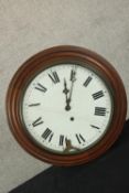 A late 19th/early 20th century mahogany cased school house style clock, the white dial with black