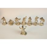 A set of eight place card holders modelled as an eight piece novelty silver frog orchestra by Mark