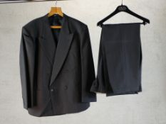 A Valentino handmade custom two piece suit comprised of a double breasted jacket and a pair of