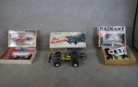 Three boxed scale model remote control cars including 1:10 Kyosho Tomahawk off road racer, 1:10