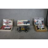 Three boxed scale model remote control cars including 1:10 Kyosho Tomahawk off road racer, 1:10