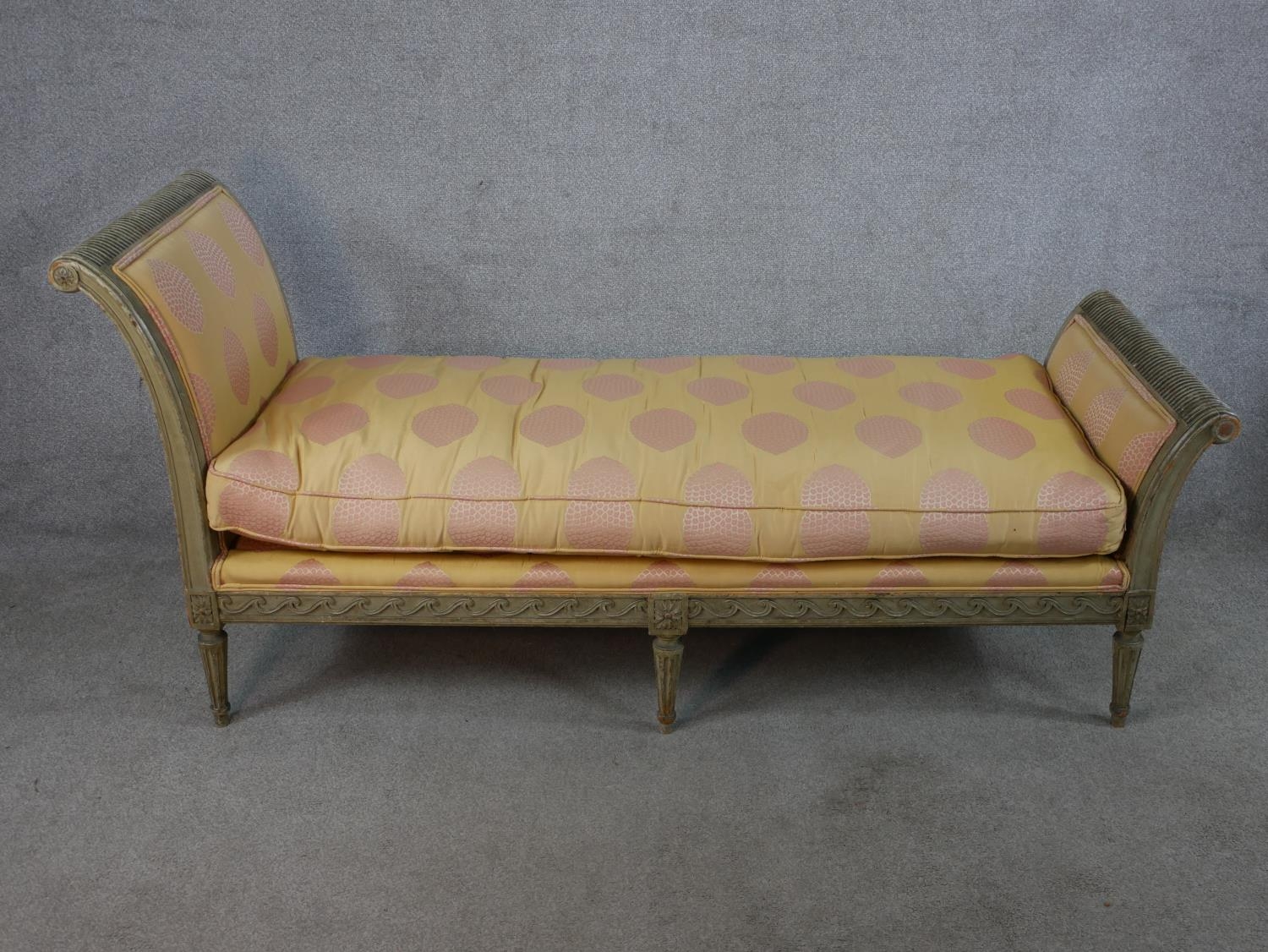 A 20th century Italian painted wooden framed daybed/child's bench with upholstered loose cushion