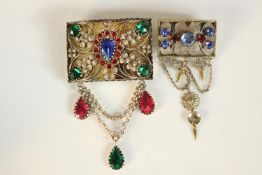 Two silver gilt and brass paste set traditional national folk costume brooches, one with scrolling