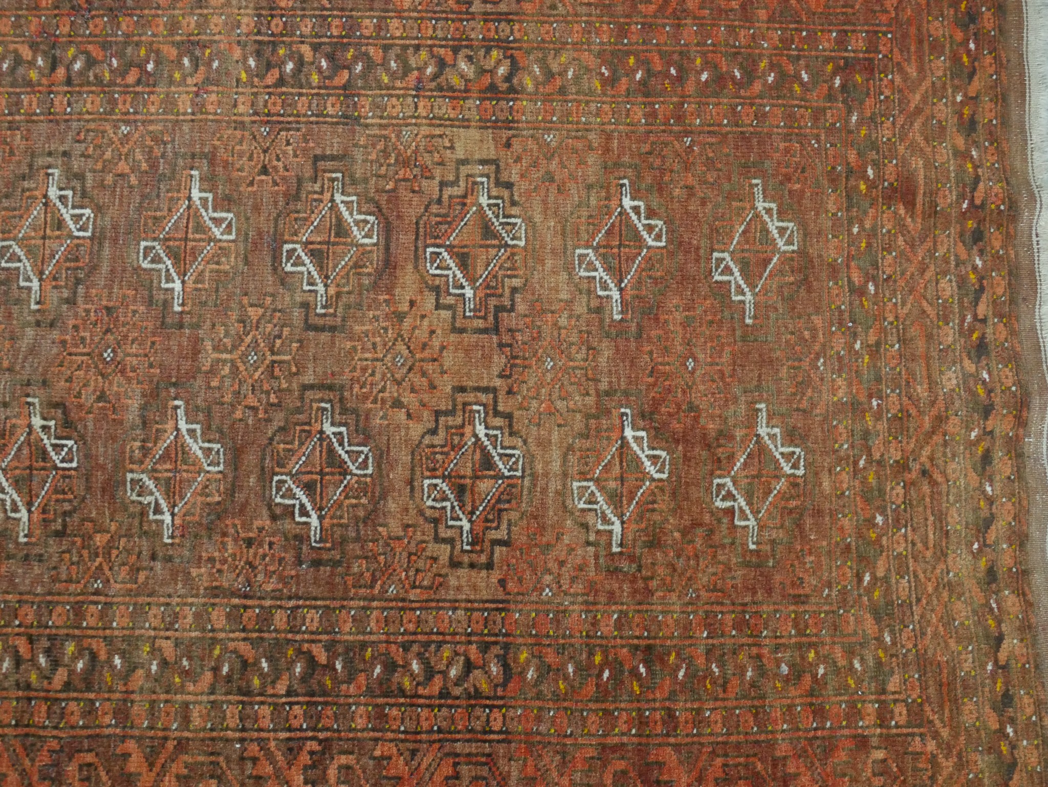 A 20th century Persian orange ground woollen rug with lozenge design within geometric border. H. - Image 3 of 4