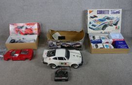 Three boxed scale model remote control cars including Tamiya 1:10 Ferrari Enzo, 1:10 Porsche 930