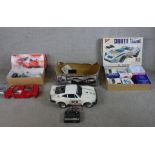 Three boxed scale model remote control cars including Tamiya 1:10 Ferrari Enzo, 1:10 Porsche 930