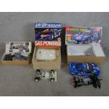 Three boxed scale model cars to include Tamiya 1:10 F103RS Chassis kit, Nissan 93 Cox racing car &