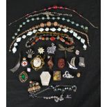 A collection of costume jewellery, including venetian foil necklaces, French paste jewellery and