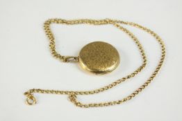 A 9ct gold floral engraved circular locket and chain. Locket hallmarked:C&F, 375. Chain stamped 9ct.