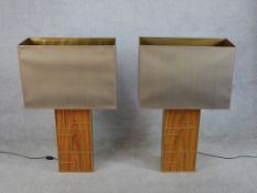 A pair of 20th century Chinese hardwood and brass table lamps with modernist design. H.97 W.60 D.