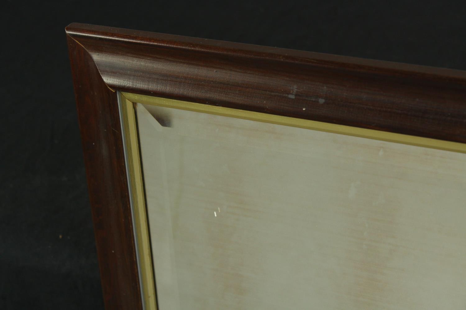 A 20th century stained mahogany rectangular and gilt framed wall hanging mirror. H.101 W.86cm. - Image 6 of 8