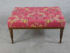 A 20th century mahogany framed button upholstered footstool raised on turned supports. H.47 W.93 D.