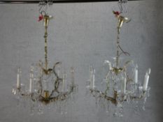 A matched pair of 20th century cut glass six branch hanging electroliers. H.97 W.63 D.63cm