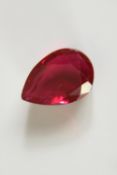 A 12.57 carat mixed cut pear shaped ruby.