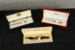 Three boxed pens to include two Caran d'Ache white metal rollerball pen and 20th century Pilot