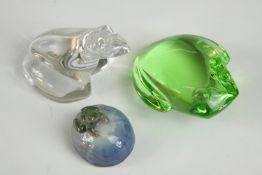 A collection of glass and porcelain frogs, including a Baccarat crystal frog etched mark with