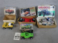 Five boxed scale model vehicles including 1:10 Robbe Baja-Bug, a 1:10 Peanuts Racer, a 1:10 Safari