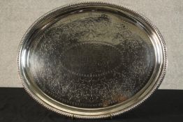 A late 19th century Sheffield plate oval shaped presentation platter with engraved inscription. W.