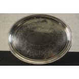 A late 19th century Sheffield plate oval shaped presentation platter with engraved inscription. W.