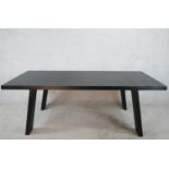 A contemporary black painted Porro table, raised on splayed plank legs, with original label. H.70