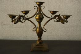A bronze effect cast metal five branch contemporary candelabra on a square base. H.40 W.52 D.15cm.