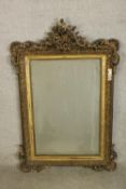 A late 19th/early 20th century Italian gesso framed rectangular wall mirror with carved