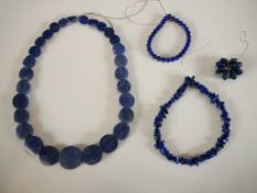 A collection of lapis jewellery, including a graduated circular bead Lapis lazuli necklace. (Largest