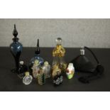 A collection of perfume bottles, including two reverse painted Chinese snuff bottles decorated