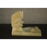 An Art Deco carved alabaster ashtray in the form of a Native American head. H.14 W.17 D.10cm.