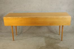 A contemporary Shaker maple wake style table raised on turned tapering supports. H.76 W.183 D.99cm