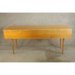 A contemporary Shaker maple wake style table raised on turned tapering supports. H.76 W.183 D.99cm