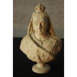 A 19th century carved white hardstone, possibly marble bust of Queen Victoria, raised on turned