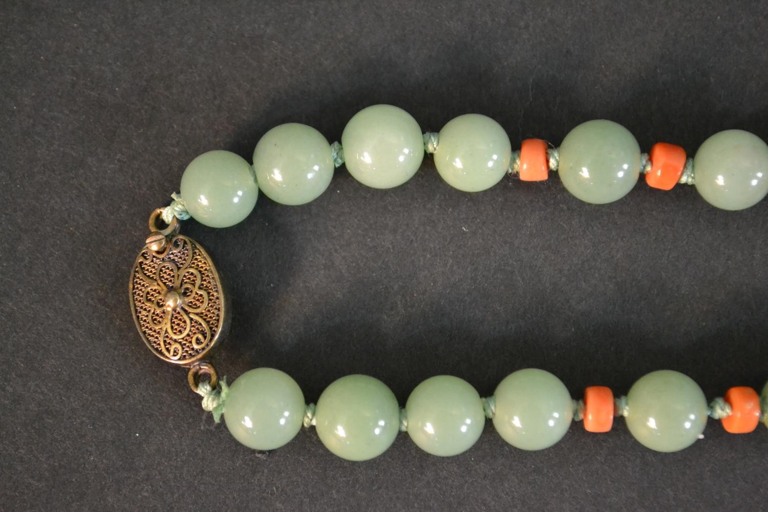 A boxed long ceremonial necklace silver gilt, jade, coral, carnelian and tigers eye pendant - Image 7 of 8