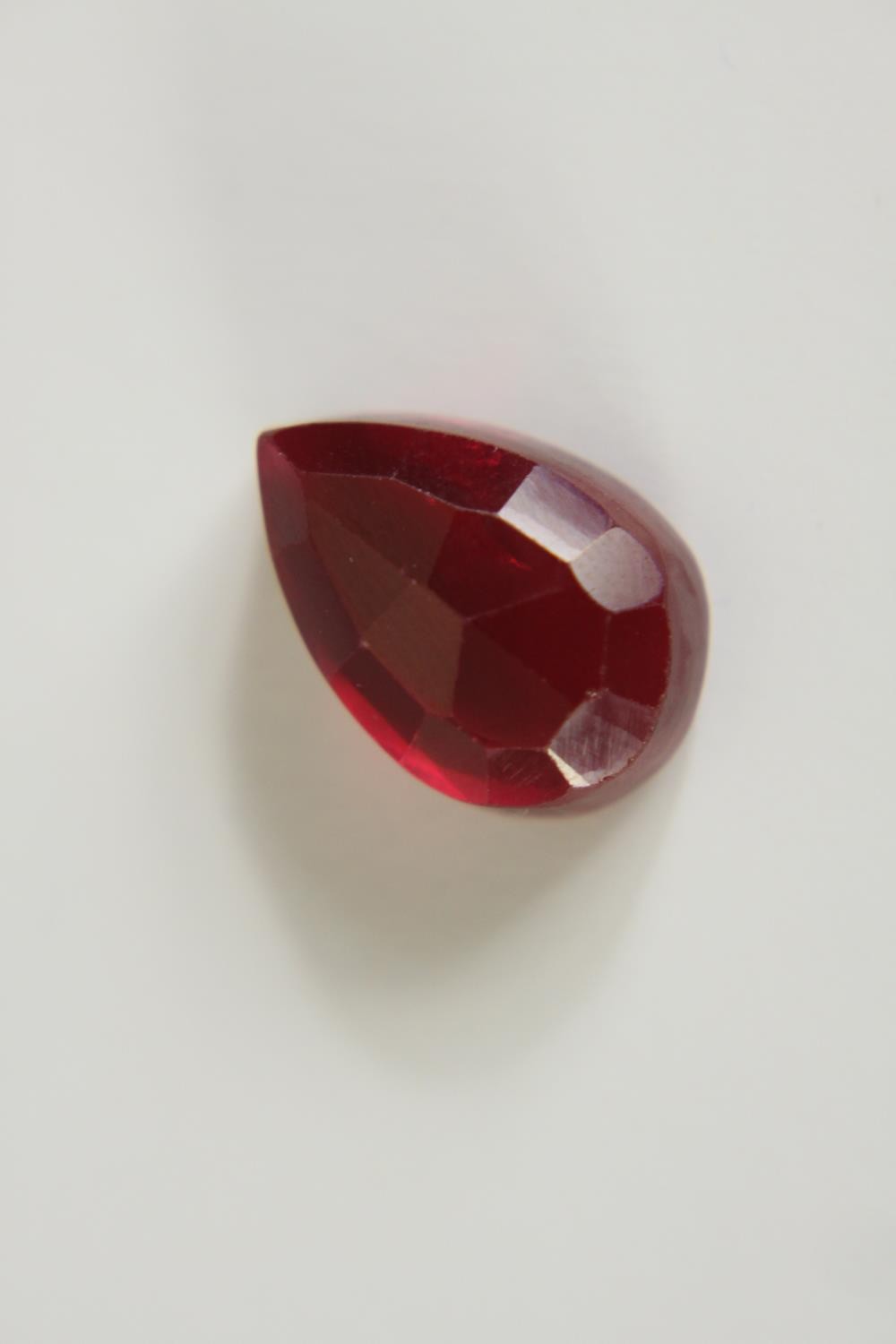 A 12.57 carat mixed cut pear shaped ruby. - Image 4 of 10