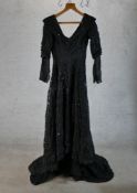 A ladies Edwardian black lace dress, reportedly from a theatre production. H.168 W.59 D.70cm