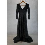 A ladies Edwardian black lace dress, reportedly from a theatre production. H.168 W.59 D.70cm