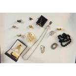 A collection of mixed jewellery, including a silver filigree wirework butterfly brooch, a black