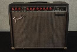 A 20th century Fender electric guitar amp with pedal switch. H.44 W.52 D.23cm.