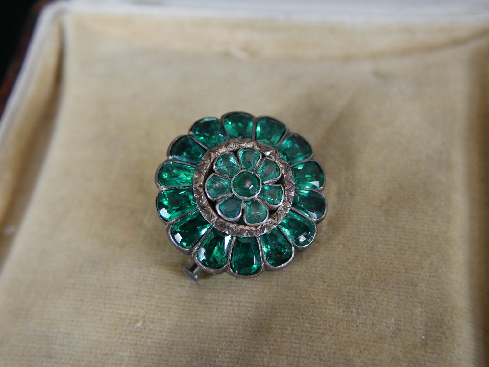 A green paste and white metal foil backed Georgian style floral brooch with secure pin and safety