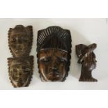 A carved African tribal mask along with a carved male bust in a hat and a double headed mask. H.27