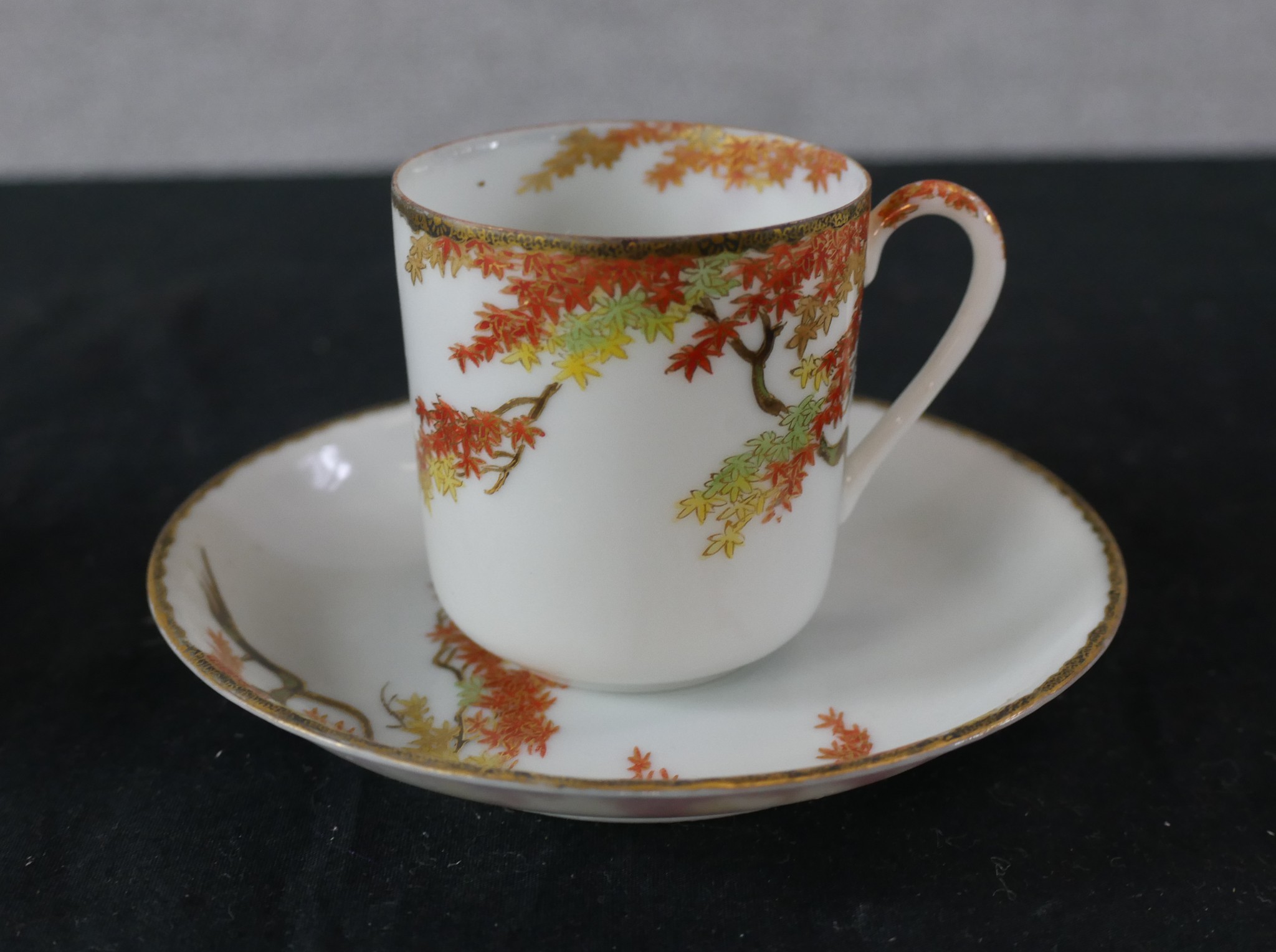 A set of four Chinese porcelain cups and saucers, decorated with autumn leaves, (with additional - Image 3 of 5