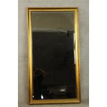 A contemporary gilt framed rectangular wall mirror. H.140 W.110cm.