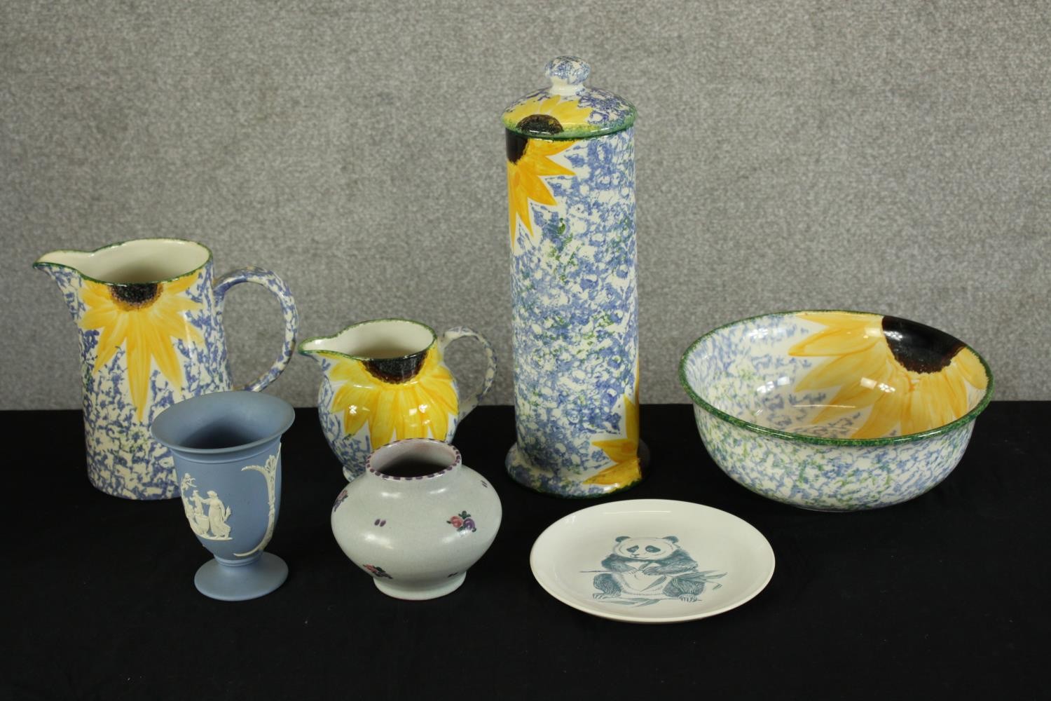 Four items of Poole Pottery 'Vincent Sunflower' including two jugs, spaghetti jar and cover and a