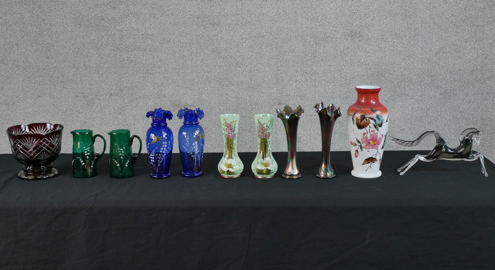 Assorted glassware to include a pair of early 20th century carnival glass vases, a pair of green