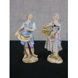 A pair of late 19th/early 20th century hand painted Meissen figures of a man with a cloth filled