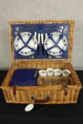 A 20th century wicker picnic hamper complete with utensils. H.20 W.59 D.39cm.