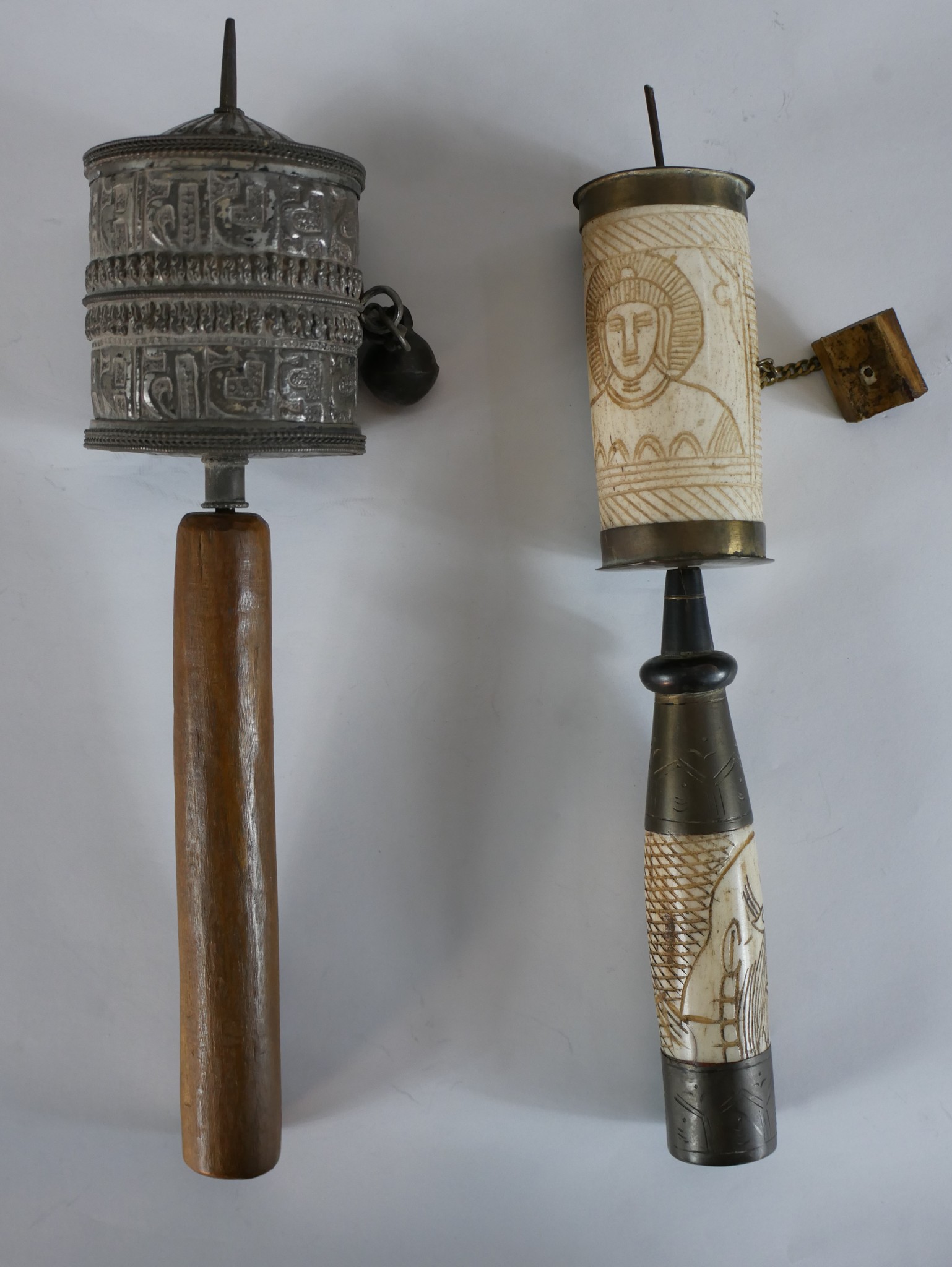 An early 20th century carved bone Tibetan prayer wheel together with a late 19th/ early 20th century