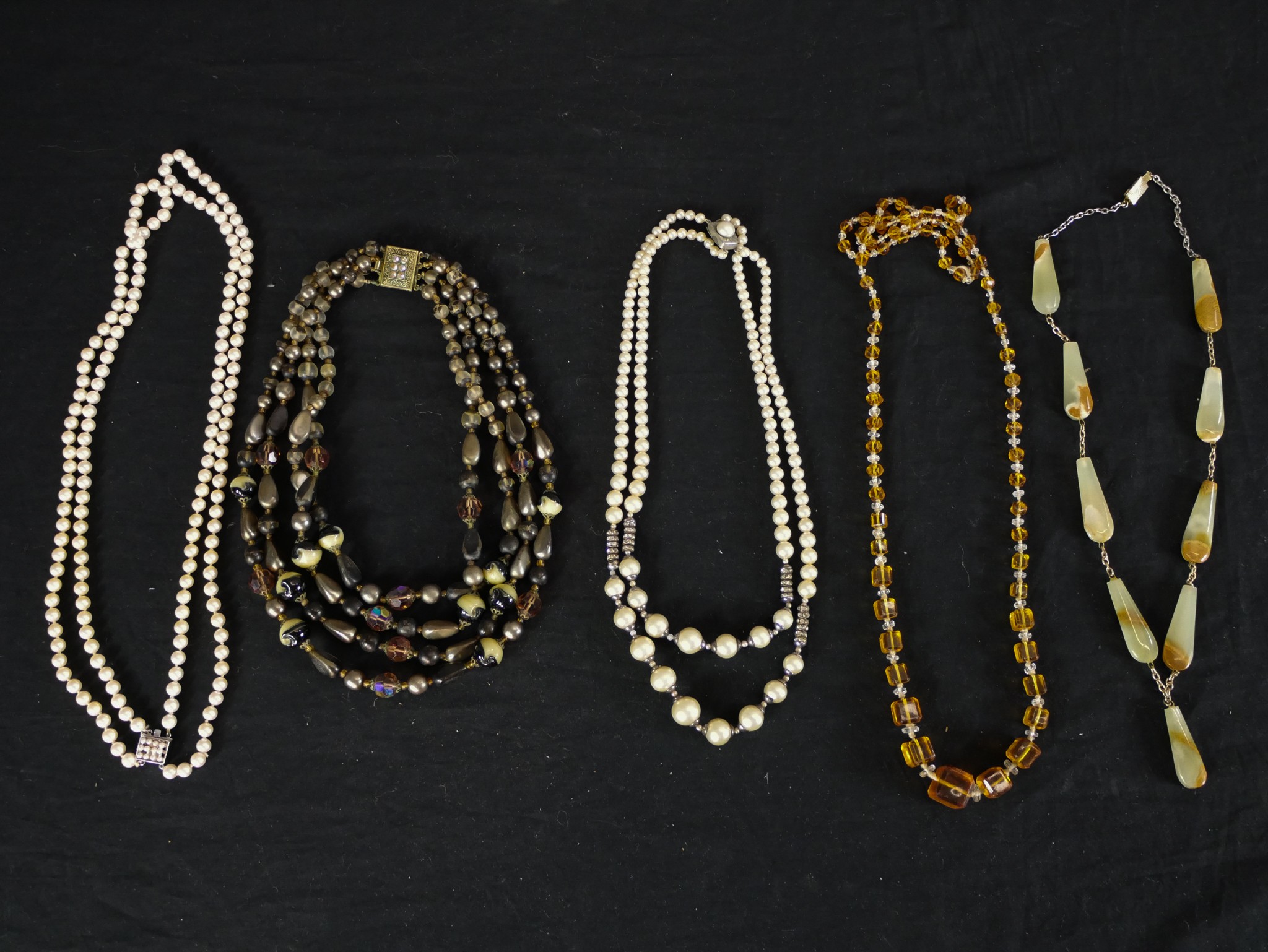 Five vintage necklaces, including an alabaster drop bead necklace, a Czech amber glass cube bead