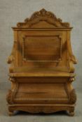 A contemporary carved stripped Keenpine open arm hall seat with storage below raised on scroll