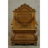 A contemporary carved stripped Keenpine open arm hall seat with storage below raised on scroll